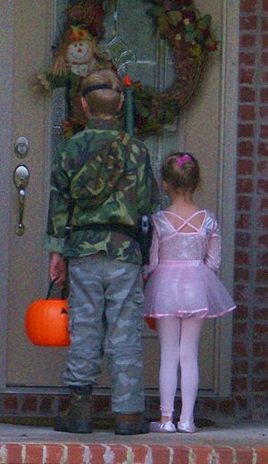 Two cousins, the boy dressed in military camou...