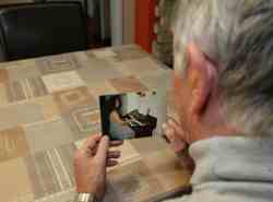 Man discovers Indonesian wife used to be man.  Huband Jan hold a photo of wife
