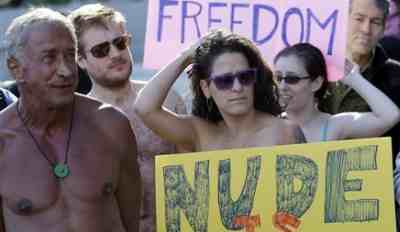 Photo of people protesting that the San Francisco public nudity ban passes