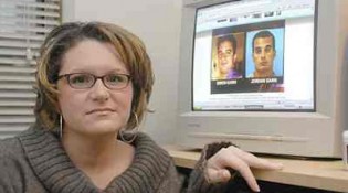 Meredith Gavin, a victim of Simon Gann and Jordan Gann poses with a photo of them on her computer