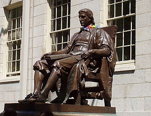 Statue of John Harvard, founder of Harvard Uni...