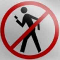 Should texting while walking be banned liek this sign shows?