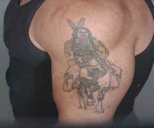 Violent fugitive Alberto Morales has a very distinct tattoo pictured here