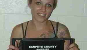 Suspected killer Angie Hill Atwood was full of smiles when arrested in this booking photo.