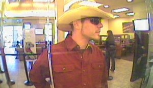 Photo of hat wearing Henderson bank robber being sought