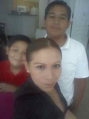 Elvira Canalez-Gomez with her 2 sons. Adrian Navarro-Canales the son on the right has been charged with murdering his mother and brother.