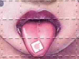 Photo of LSD blotter placed on tongue.