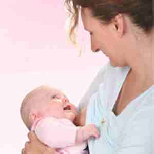 Photo of woman breastfeeding a child